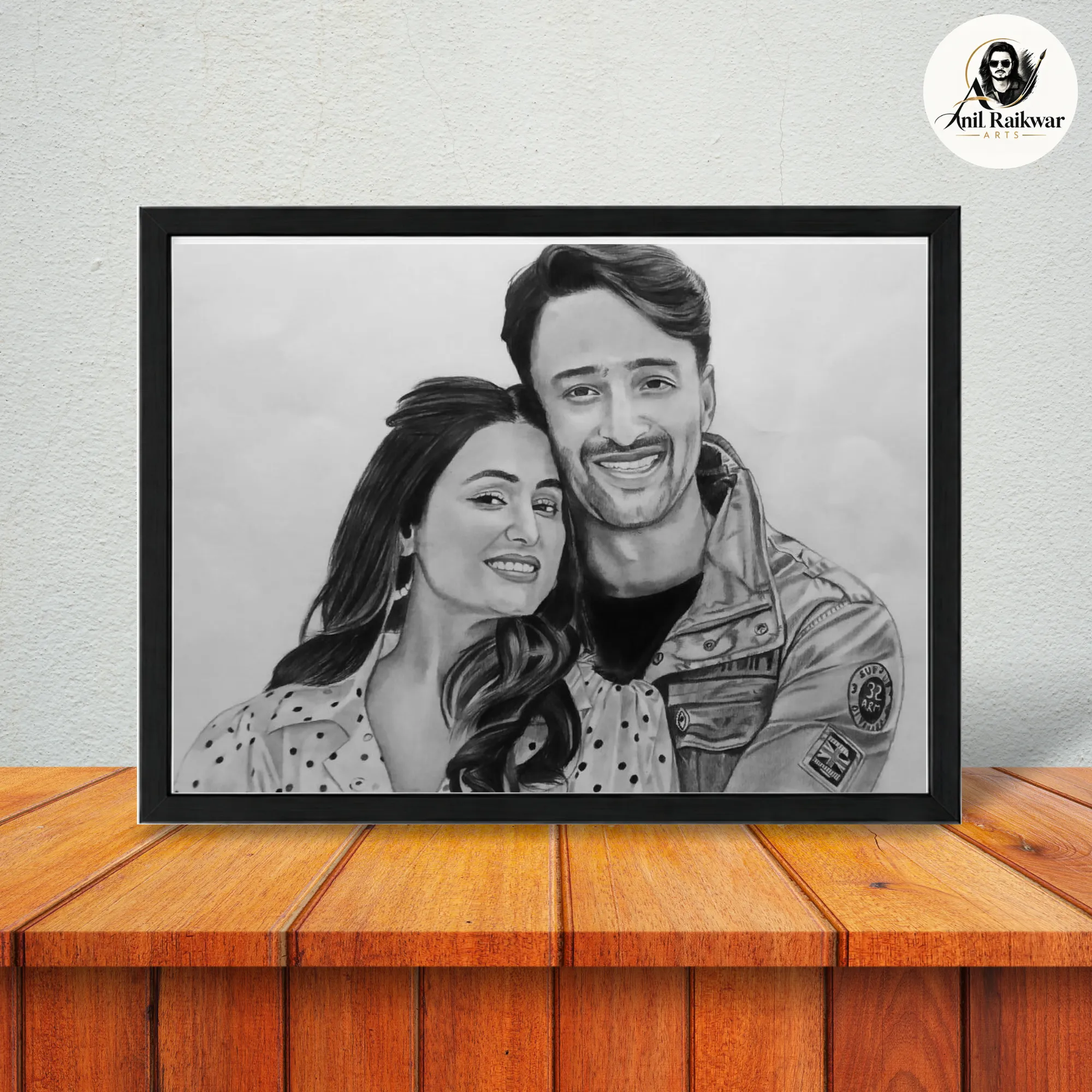 Framed black and white pencil sketch gift for couple showing a smiling pair in a hand-drawn portrait